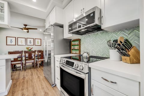 New Induction range, more than 50 different spices and seasonings, gourmet Henckel kitchen knives.  Kitchen features high end cookware outfitted for a cooking enthusiast.