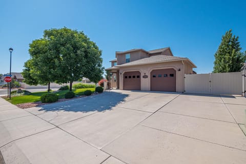 Spacious driveway and three-car garage for easy parking and storage