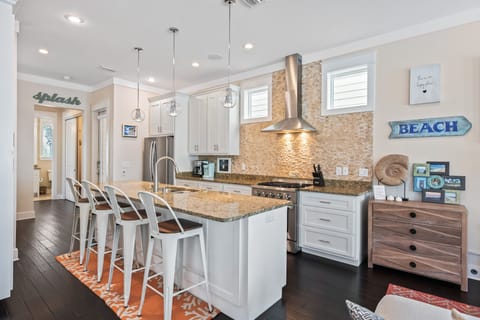 Family room open to kitchen and dining area. Kitchen/ Back entrance 