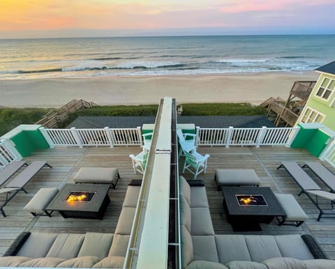 Cozy up by the fire pits on the rooftop decks ("Sun" left and "Stars" right)