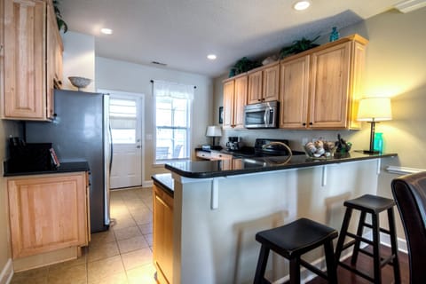 Bar stools looking into the kitchen