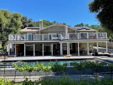 Back view of the main house with new pool/Jacuzzi just completed in May 2024. 
