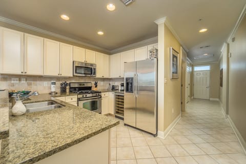 Kitchen with granite counter tops and stainless steel appliances.