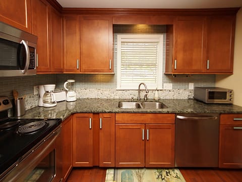 All cabinets stocked with all the dinnerware and cooking utensils you need!