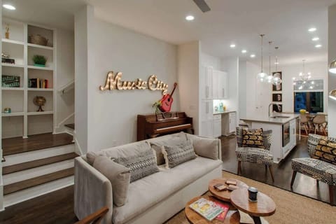A piano and guitar are ready in the living area for your spontaneous jam sessions.