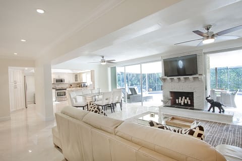 Flat screen TV in the family room with easy access to the screened-in pool