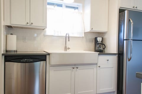 Farmhouse sink, new cabinets and quartz countertops 