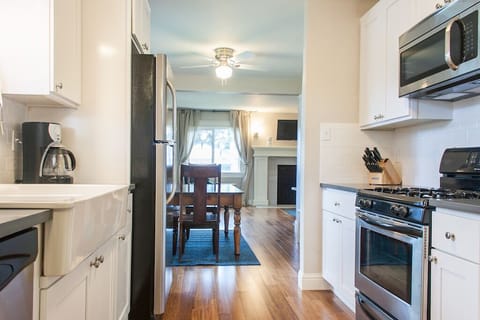 Galley kitchen leads to the dining and living rooms