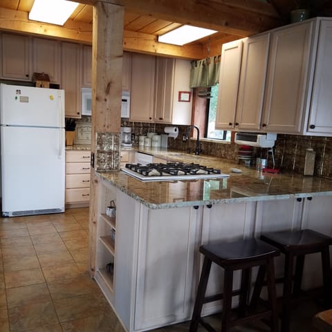 Updated kitchen .granite countertops, new dishwasher and gas range. 