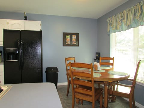 Dine in comfort, seating for four with a view.