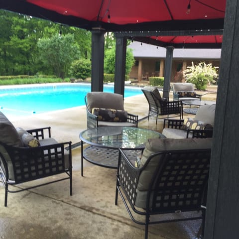 Poolside conversation areas, fire pit, outdoor dining, hot tub & porch w/rockers