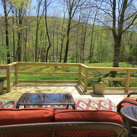 view of the river and yard from the deck
