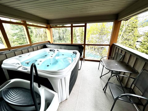 Hot tub off the bedroom, overlooking the outdoor pool