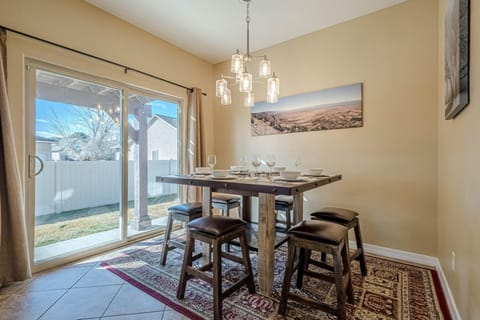 Bright dining area with garden views and cozy seating