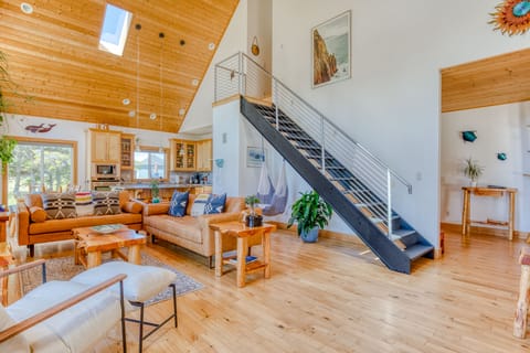 The great room is bathed in natural light and filled with live house plants
