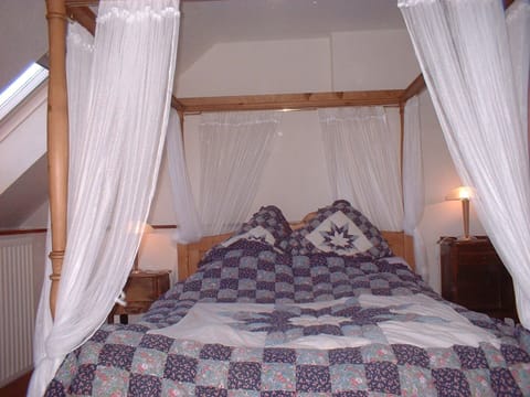 The master bedroom with four-posted bed