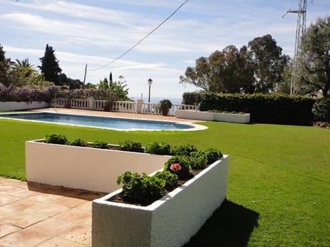 Patio, Swimming Pool and views to the sea. 