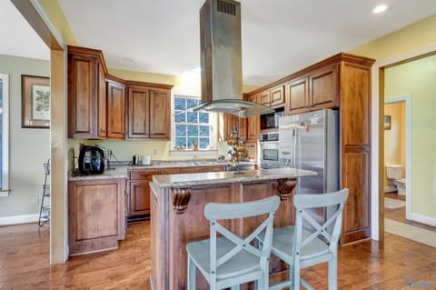 Bar area on island seats 2 and six chairs at dining room table. Seating for 8
