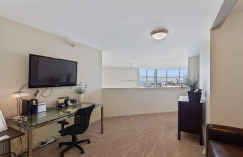 Upstairs loft with full sized sleeper sofa, TV and workstation.