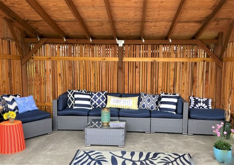 Outside covered area offers privacy and comfort while sitting by fire pit.