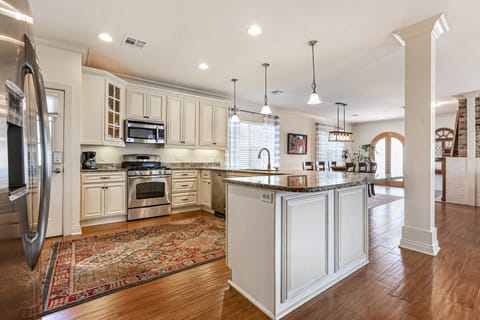 Kitchen over looking dining rooms and living room. 