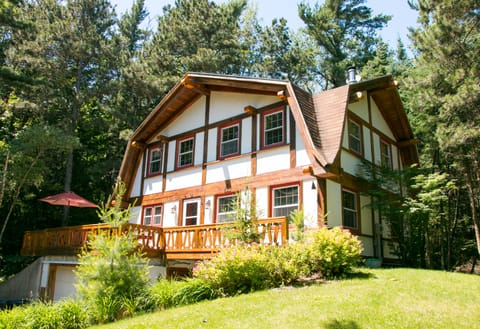 The Prancing Pony - a Norweign style timberframe home with handcarved features.