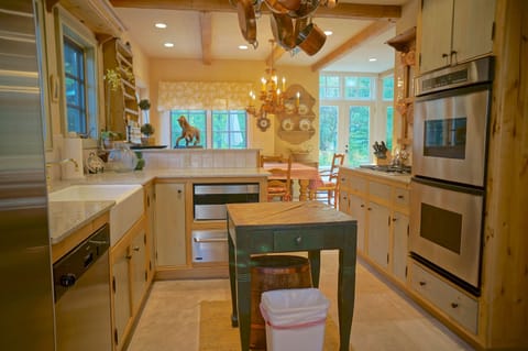 Enjoy a Sub Zero fridge, dishwasher, 4 burner gas range and dual Dacor ovens