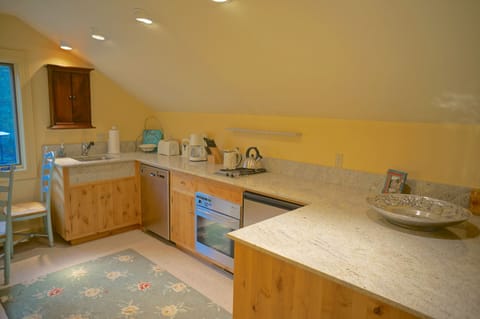 Above the garage is a full apartment that includes a full bathroom and bedroom