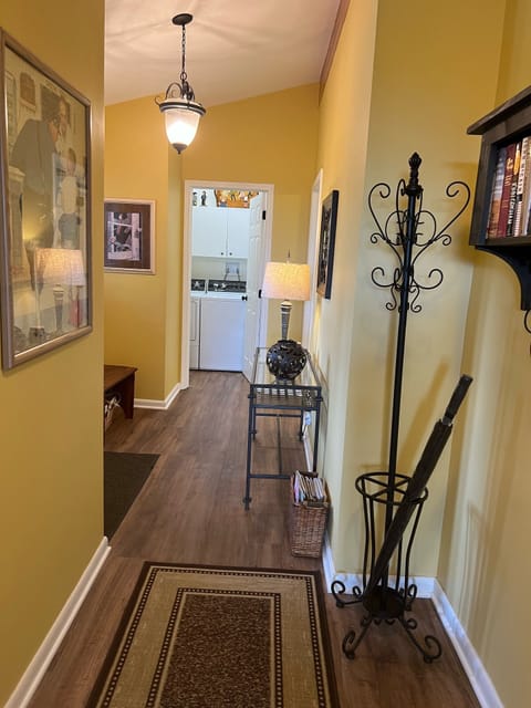 Hall leads to bedrooms and laundry room. 