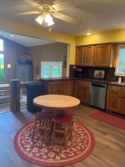 Fully stocked kitchen. Stainless steel appliance Table for kids or snacks 