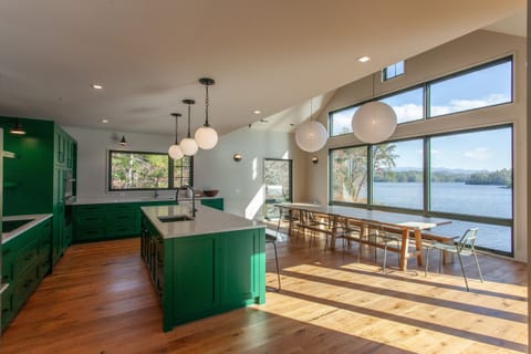 New custom kitchen with custom 12'-0" dining table. The view is the main thing