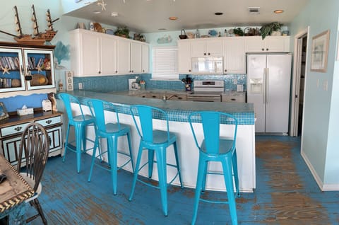 Designer glass tile and extra cool barstools!