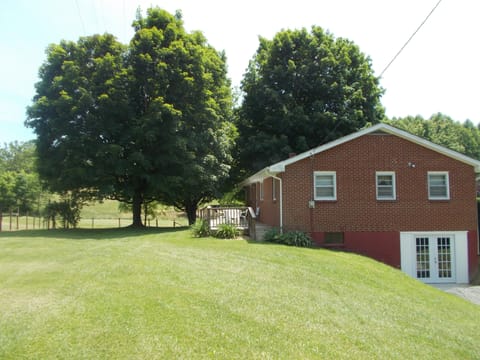  Large yard with back deck and plenty of shade trees. Grill on back deck. 
