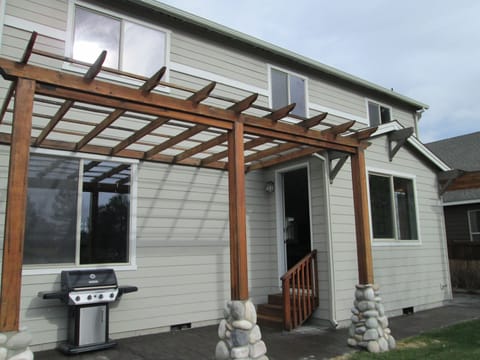 Gas grill with patio dining set for outdoor entertaining