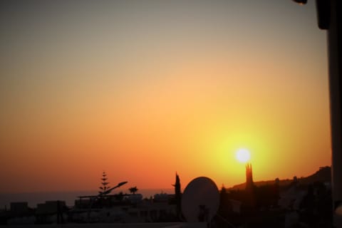 Sun setting as can be viewed from the apartment terraces or bathroom window.