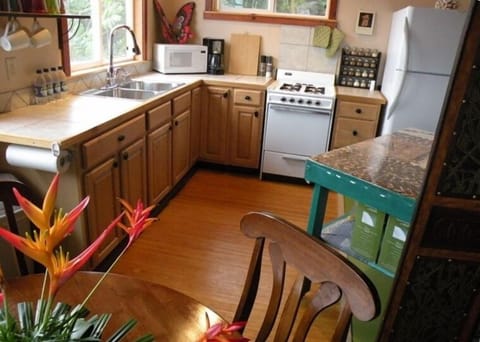 A fully-equipped kitchen and dining area provides modern convenience
