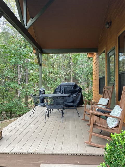 Large lakeside porch with grill, table, rocking chairs!