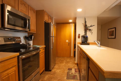 Kitchen view to pantry door.