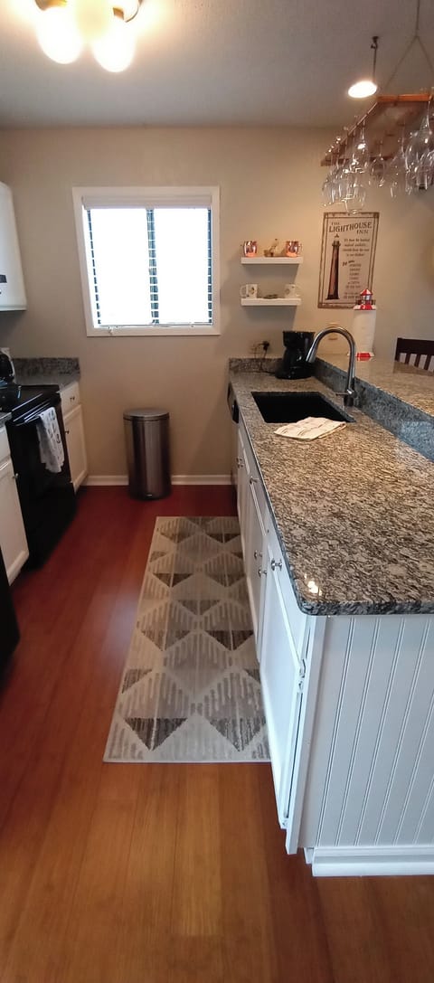 New Granite  2021- 
View looking out kitchen window with new white enamel.