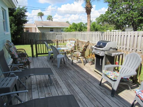 Exterior deck with BBQ grill and plenty of seating.