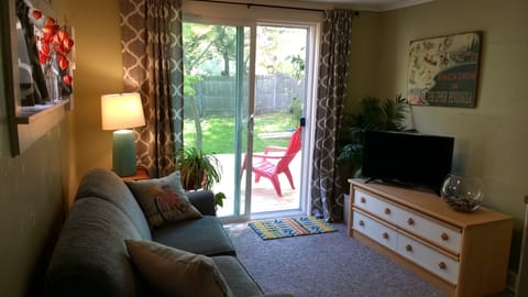 Comfortable living room with plenty of natural light. 