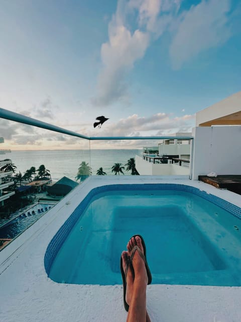 Open-Air and uncovered rooftop spa, weather conditions may affect heat retention