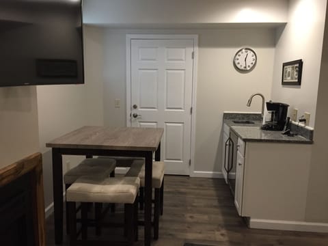 Lower level wet bar with coffee maker and wine fridge