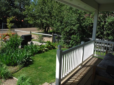 front porch with couch for kicking back and looking at the mountains or a BBQ
