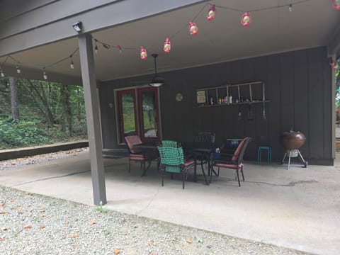 Carport with ceiling fan. Charcoal grill