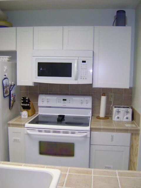 Glass top stove and microwave.