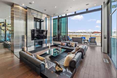 Beautiful Sleek Retreat Sunken Living Room with water view