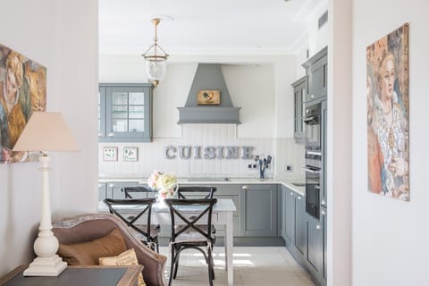 The kitchen is sunny and spacious.