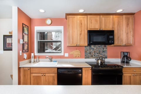 Quartz counter tops, all new appliances and solid hickory cabinets.