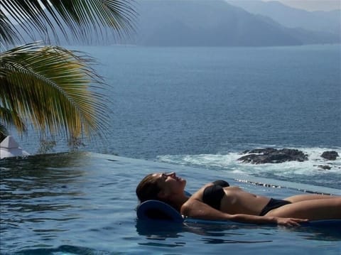 Upper infinity pool off livingroom with views of Pacific Ocean